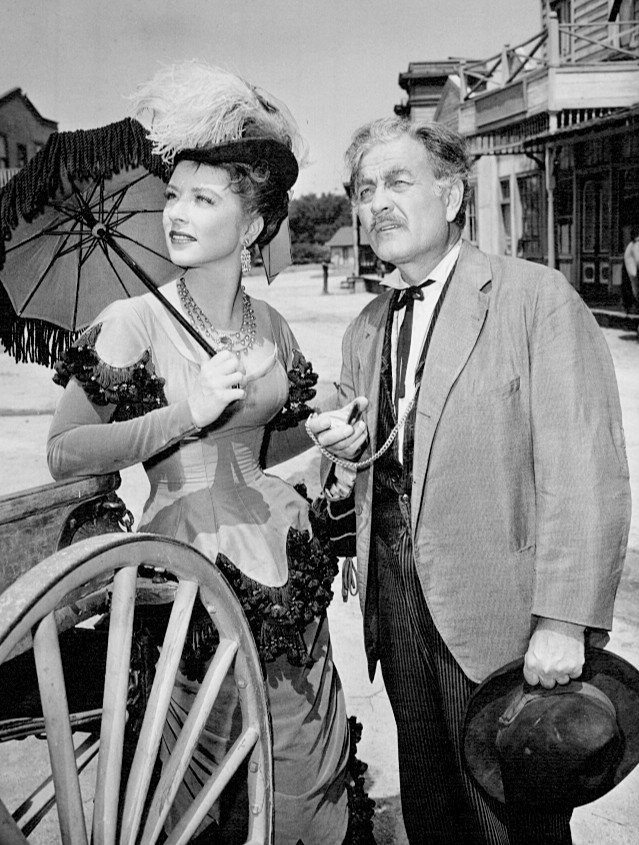 Photo of Amanda Blake as Miss Kitty and Milburn Stone as Doc Adams from Gunsmoke.