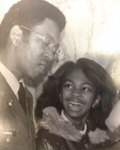 Photo of Young Harris Faulkner with her late father