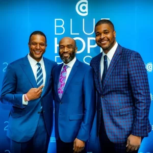 Photo of Craig Melvin wth his brothers, Lawrence and Ryan