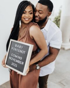 Photo of Bri anouncing her pregnancy with her husband