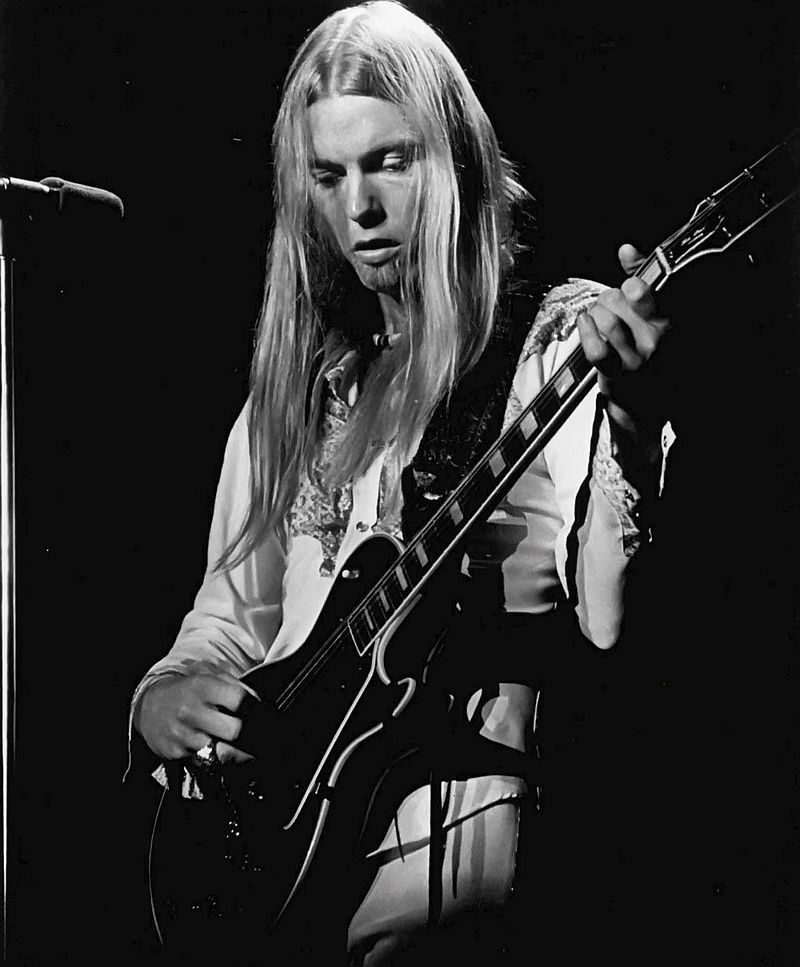 Photo of Gregg Allman performing with the Allman Brothers Band.