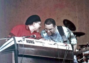 Photo of Art Neville (left) and George Porter Jr. of the Funky Meters at New Orleans Jazz & Heritage Festival 2004