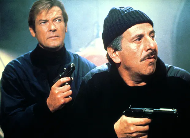 Chaim Topol with Roger Moore (left) in 1981 James Bond film For Your Eyes Only. Photograph: Cinetext Collection/Sportsphoto/Allstar